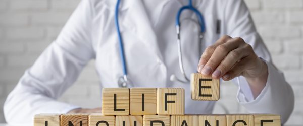 close-up-doctor-holding-wooden-cube